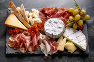 Top view Gourmet charcuterie and cheese board. AI Generated.